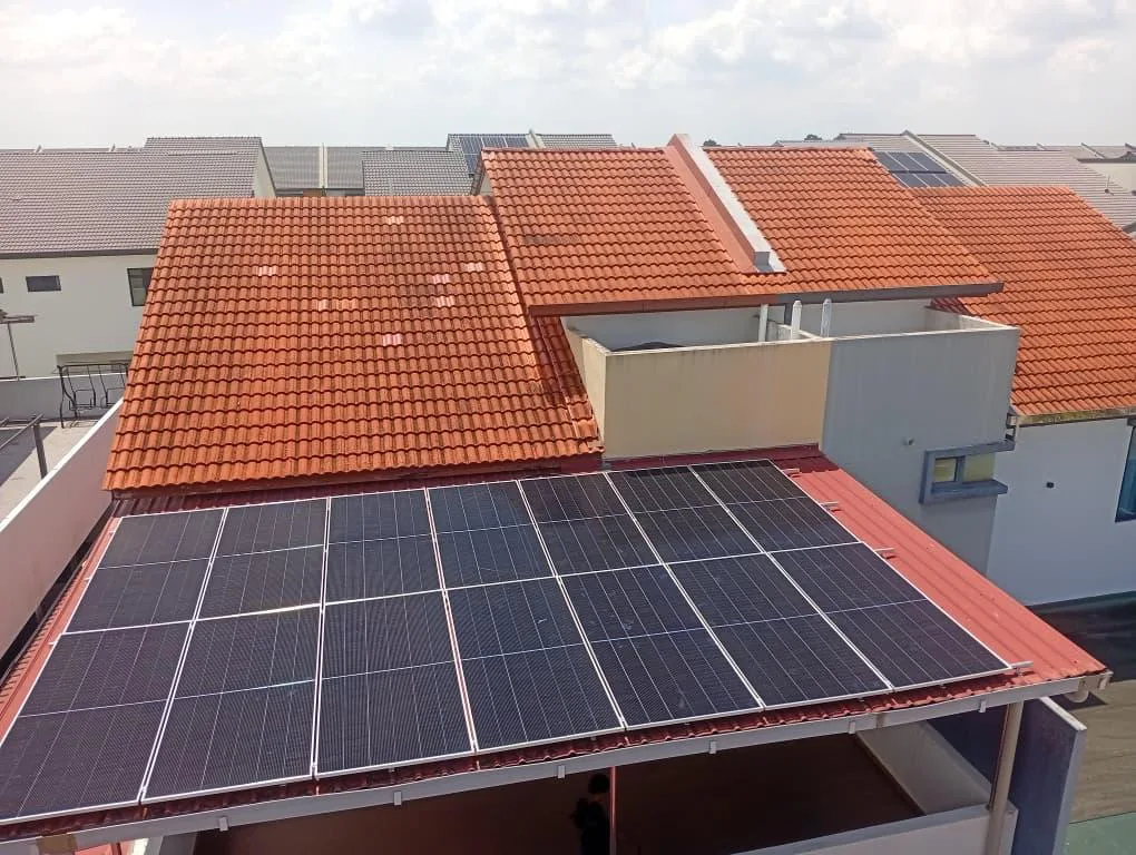 Rooftop solar array on the orange-tiled roof of a terrace house