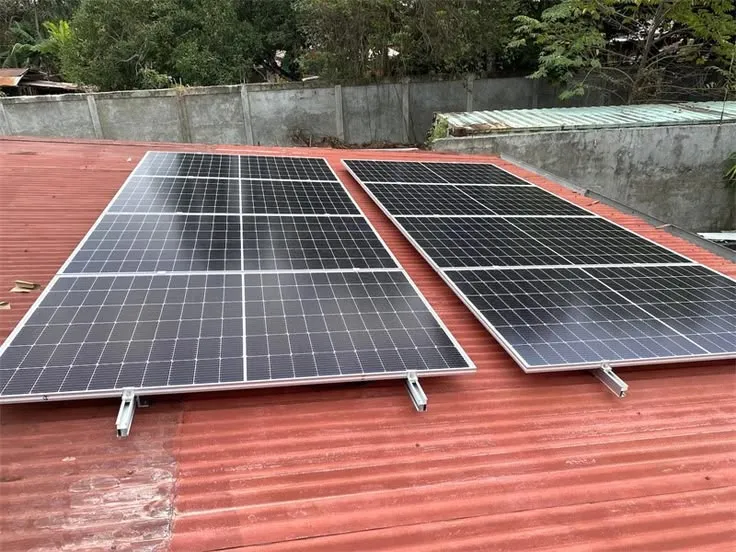 Illustration: two sets of solar panels on a red corrugated roof